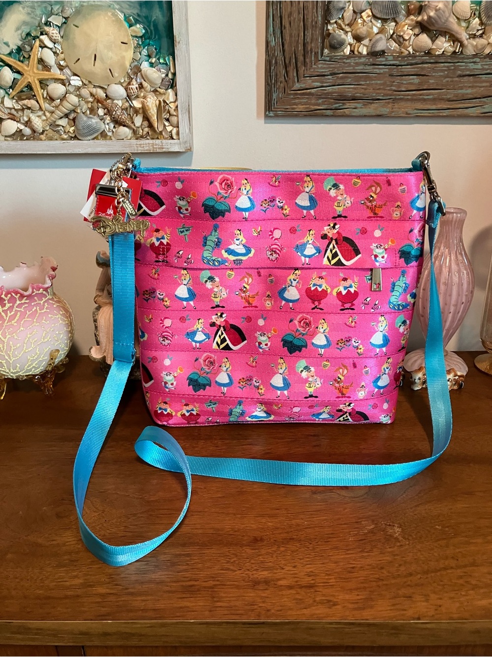 Harveys Seatbelt Disney Alice in Wonderland Pink Crossbody Bag with Blue Strap